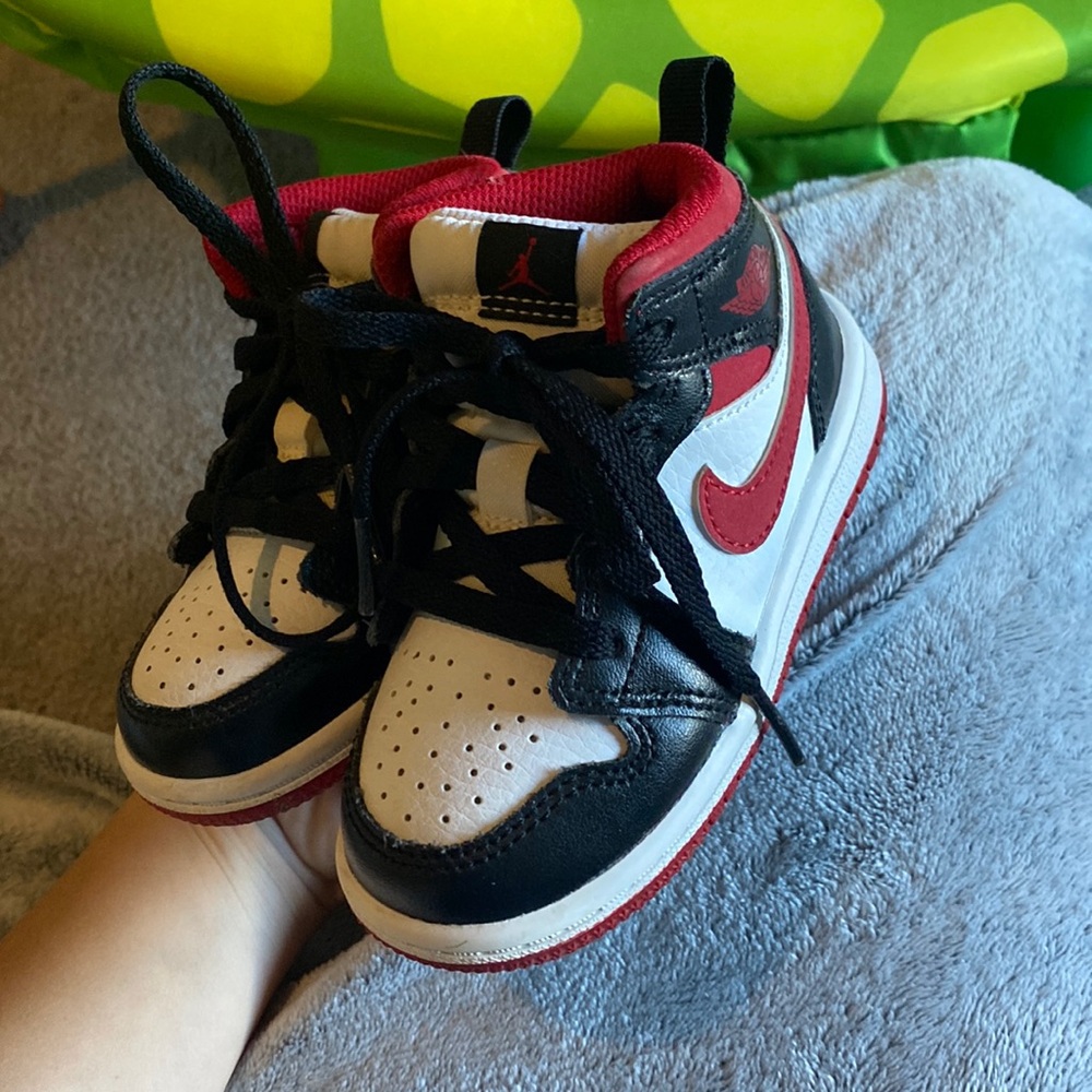 red white black high top Jordan’s